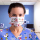 Illustration for article titled Nurse Wearing Snoopy Scrubs, Floral Face Mask To Work Must Think Pandemic Some Kind Of Joke